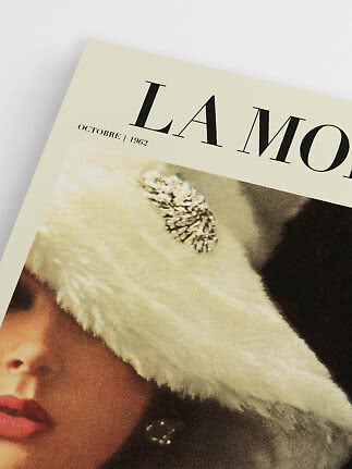 Close-up of a vintage magazine cover with woman in white fur hat and text "L'AMOUR, October 1962"