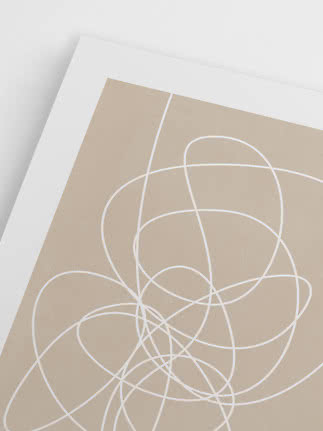 Close-up of beige poster with white abstract line art and white border