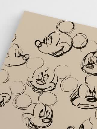 Beige Oberfläche mit schwarzen Skizzen von Mickey-Mouse-Gesichtern mit verschiedenen Ausdrücken