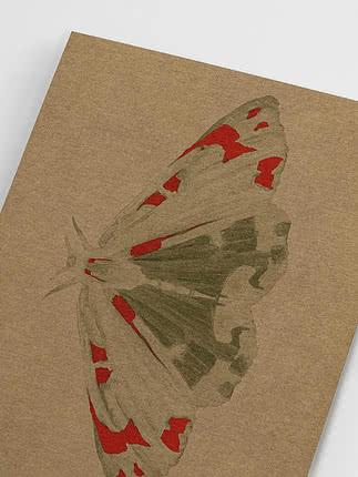 Angled close-up of the unframed print showing the dry pencil scales, the hard edged red patches and the bare kraft