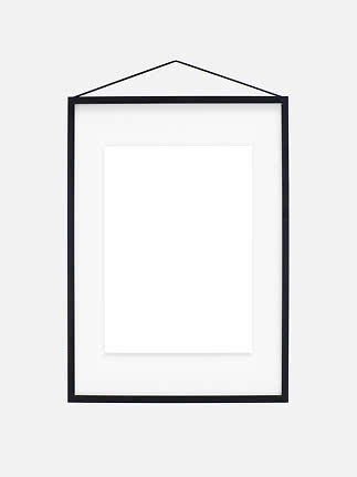Black picture frame with white mat and hanging cord