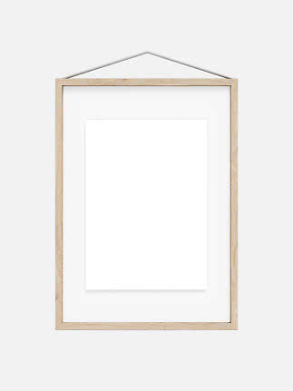Light wood frame with white mat and blank poster, hanging from a cord