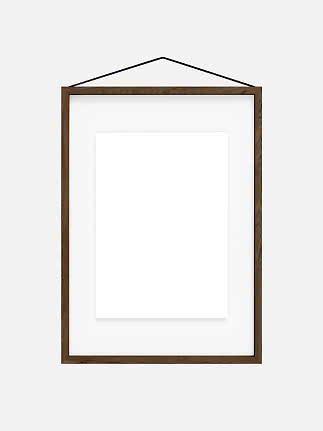 Brown wooden picture frame with white mat and blank insert, hanging from a black cord