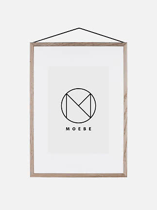 Light wood frame with white mat and black hanging cord