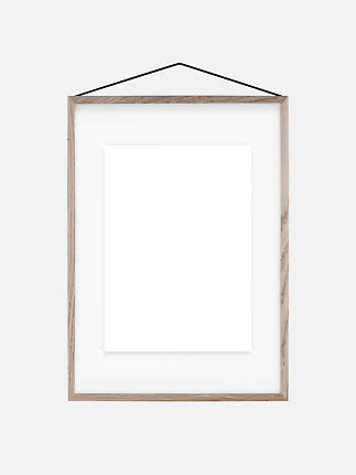 Wood-look picture frame with white mat and black hanging cord