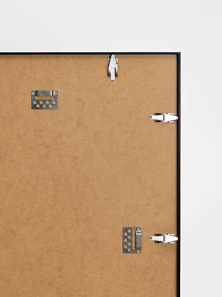 Back of framed notice board with MDF backing and metal wall mounting brackets
