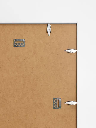 Back of framed notice board with MDF backing and metal hanging clips
