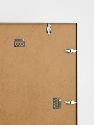 Back of a framed picture with hanging brackets and swivel clips