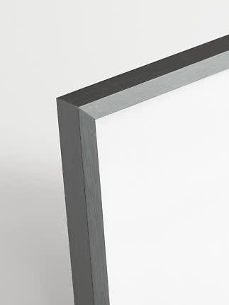 Close-up of the corner of a square frame in brushed gray metal on a white background