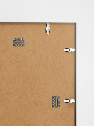 Back of framed picture with MDF board and metal wall hanging clips
