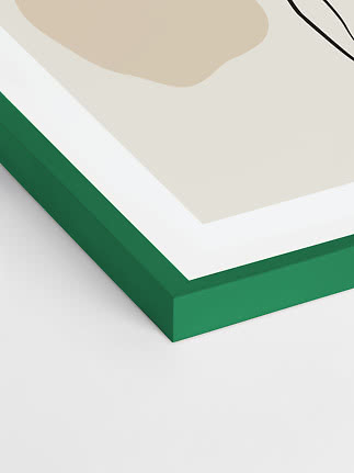 Nahaufnahme eines gerahmten abstrakten Prints mit grünem Rahmen und weichen Formen