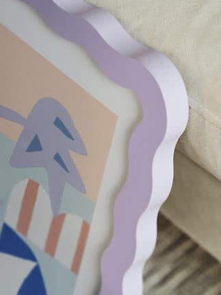 Close-up of trays with scalloped edges in pastel colors and a graphic pattern
