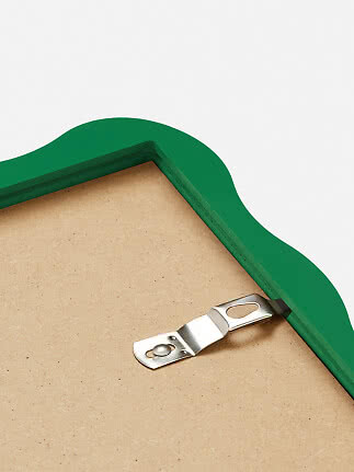 Back of a green wavy frame with metal hanging hook