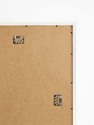 Back of white Versailles picture frame with MDF backing and metal hanging clips