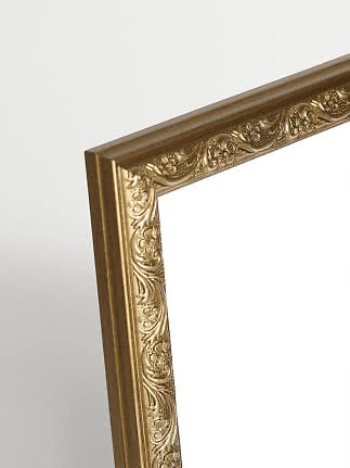 Close-up of gold picture frame with ornate floral detailing