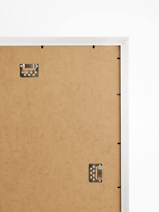 Back of white picture frame with MDF backing board and metal hangers