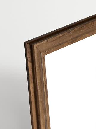 Close-up of Madeleine walnut picture frame with warm wood grain and slim profile