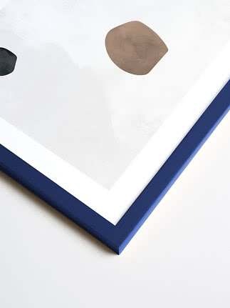 Abstract art print in blue frame with white background and organic brown and black shapes