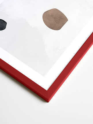 Abstract framed art print with red frame, white background, and organic brown and black shapes