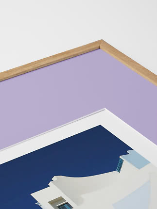 Close-up of framed art print with lilac background and wooden frame