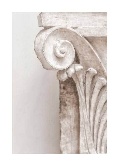 Close-up of a carved capital in light distressed wood with spiral and leaf details