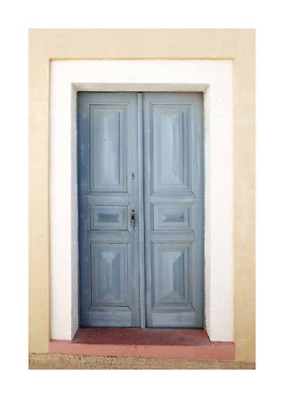 Light blue wooden double door set in a cream wall with white trim