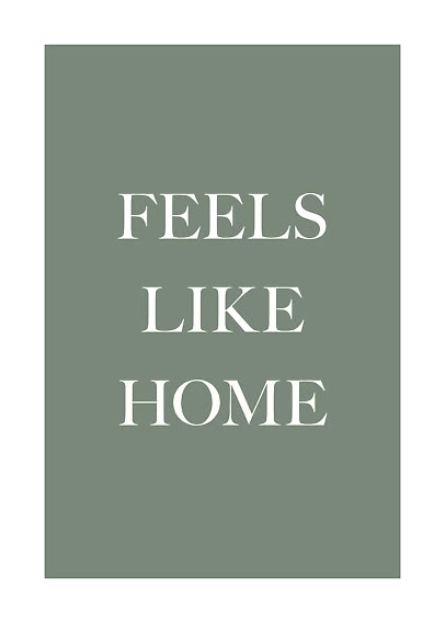 Green poster with white text reading “FEELS LIKE HOME”