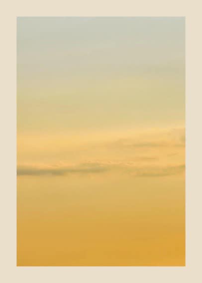 Abstract scene of golden sky with soft clouds and a warm color gradient