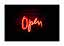 Enseigne lumineuse rouge indiquant « Open » sur fond sombre
