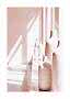 Pink decorative vases in a sunlit room with long shadows