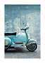 Light blue vintage scooter parked against a blue-gray wall