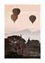 Three hot air balloons over ancient temples and misty hills at sunrise