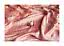Opened lychee on pink glossy fabric with soft folds