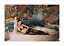 Model in black lace lingerie and blue heels by a bathtub against a colorful mosaic wall