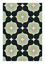 Abstrakt geometriskt mönster med mörka former och mjuka tonade blommotiv i mint, beige och persika