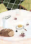 Watercolor of a set table with bread, grapes, a pitcher, and butter on a plate