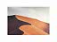 Art print of golden desert sand dunes with soft shadows under a pale sky