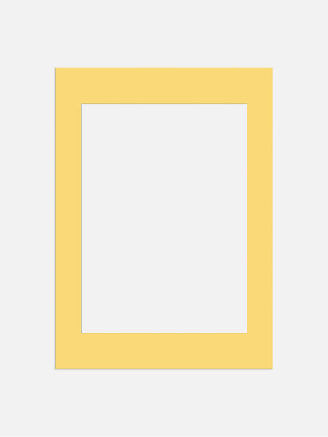 Yellow rectangular mat frame with large opening on a light background