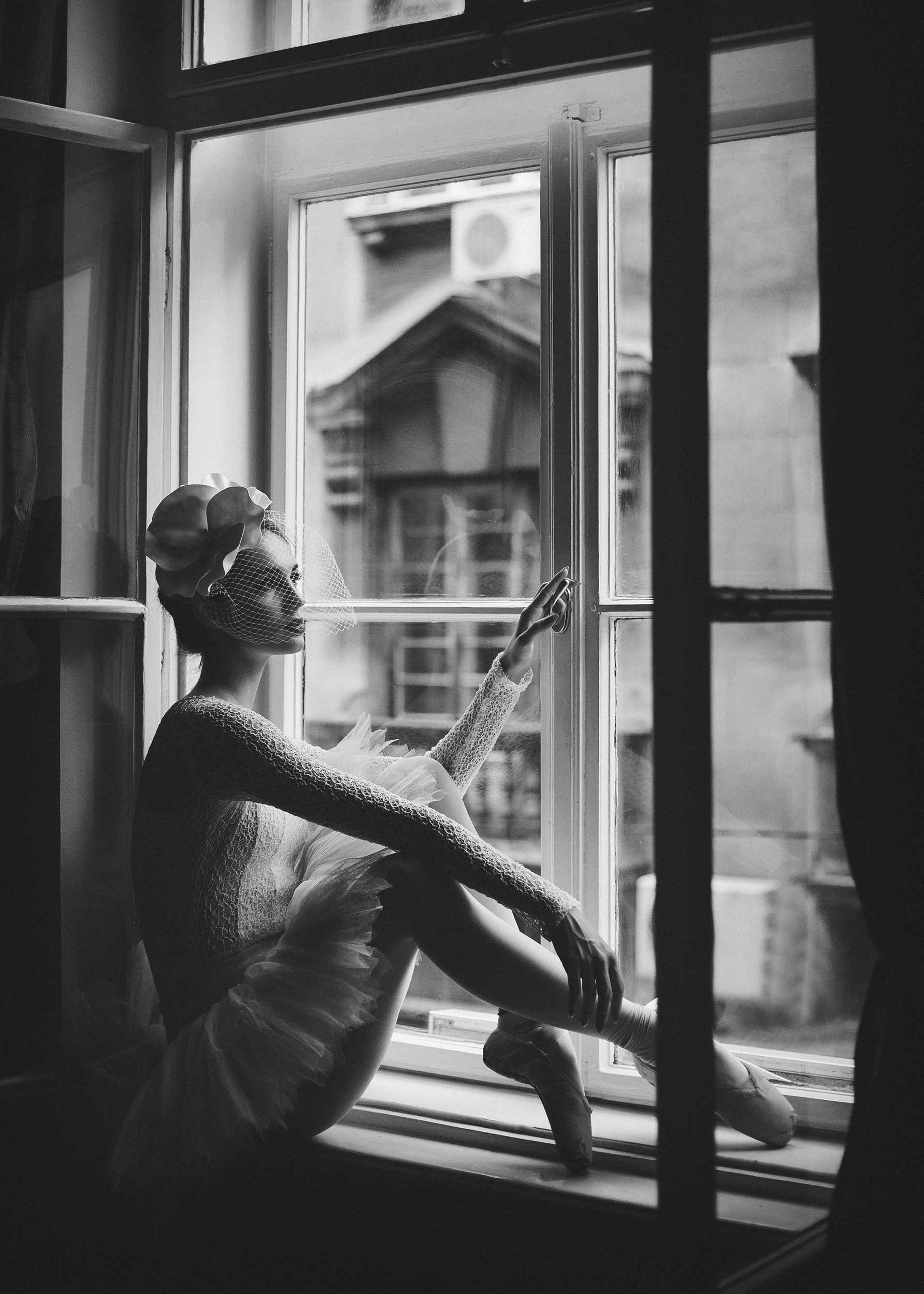 Ballerina in Window Poster - Black and white dancer photo (70x100 cm)
