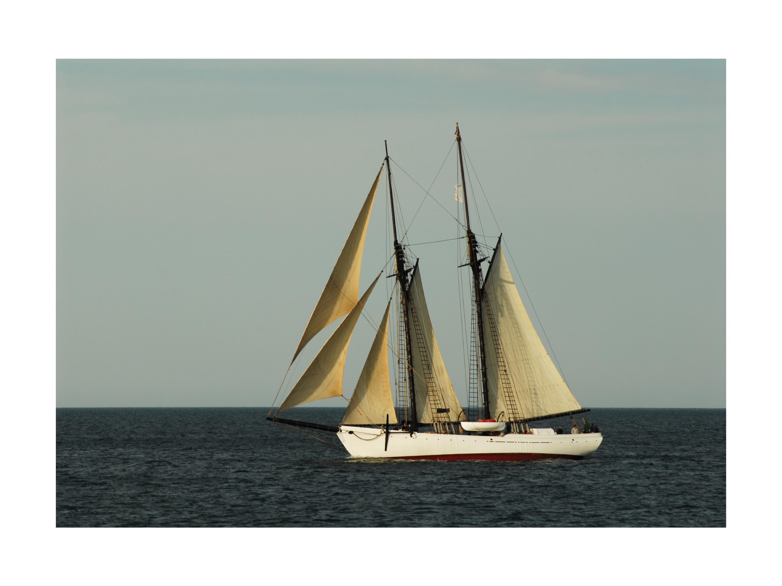 Schooner Sailing Off Poster - Sailboat photography (50x70 cm)